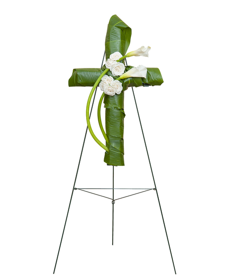 Sympathy cross of calla lilies, roses and greenery. 