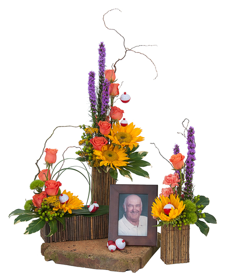 Natural containers and bright flowers to surround the photograph of a loved one. 