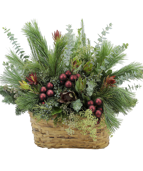 Evergreens and holiday ornaments in a festive basket design