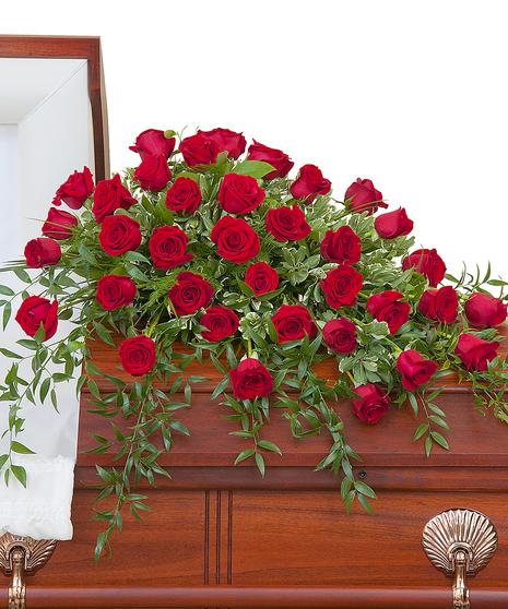 Three dozen roses with premium foliage in a casket spray. 