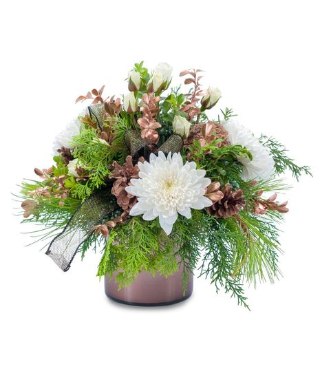 Mixed winter greens and white flowers accented with pine cones and rose gold boxwood