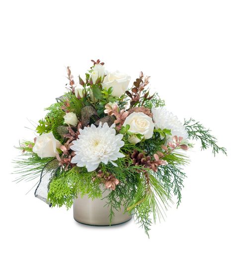 Mixed winter greens and white flowers accented with pine cones and rose gold boxwood