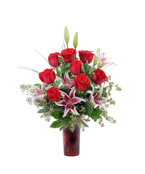 Red roses & lilies in a red vase.