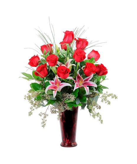 Red roses & lilies in a red vase.
