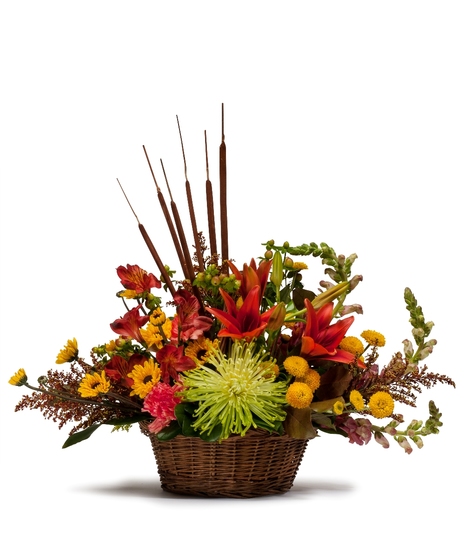 Wicker basket filled with fall flowers. 