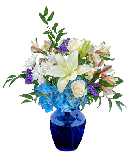 Blue and white flowers in a deep blue vase.